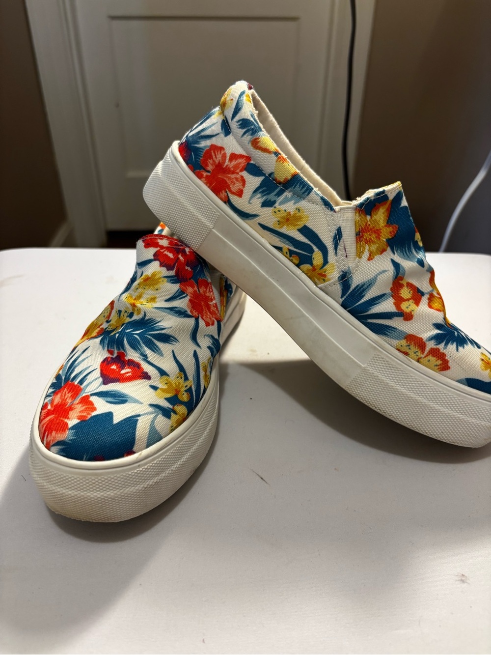 Soda White Floral Slip-On Sneakers with Red, Blue & Yellow Print